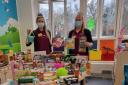 Play specialists, Kristy (left) and Emily (right) with donations from previous year