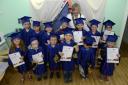 Top of the class: Children with their graduation bears