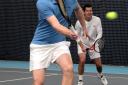 Long haul: Richmond Tennis Club coach Michael Jones joined Tim Henman, right, on court at the National Tennis Centre in Roehampton to raise money for charity 	SP82668