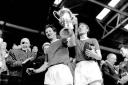 Winner: Roy Law, left, lift the FA Amateur Cup after the 4-2 win over Sutton United at Wembley in 1963       Photos: Dave McKnight