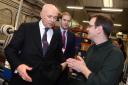 Databac production manager David Gaskin shows Iain Duncan Smith and James Berry around the factory