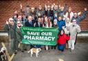 Abdool Kureeman, Gillian Russell and Ashtead residents celebrate after the NHS approved Mr Kureeman's second application to open a new pharmacy in the village
