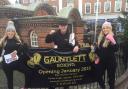 From left, Pip Smith, 22, Chris Gauntlett, 49, and Chloe Gauntlett, 22, advertise the new Gauntlett Boxing Club