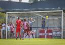 Mikel Miller's header finds the back of the net in Casuals' 4-2 loss to Carshalton. Picture: Stuart Tree