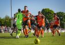 Walton Casuals players celebrate their penalty shoot-out win at Corinthian-Casuals. Picture: Stuart Tree