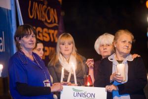 SUNDAY AM KIN/SC/ELM Nurses hold candlelight vigil against hospital cuts