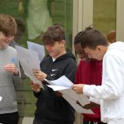 Friends find out their grades at Claremont Fan Court School in Esher