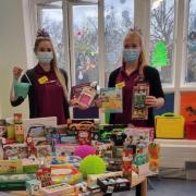 Play specialists, Kristy (left) and Emily (right) with donations from previous year