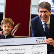 Theo, in Year 1, collecting the cheque with Headmaster Mr Brierly