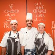 YMCA Canteen catering manager Yann Troalen with second chef Jose Neves, left, and trainee chef Natalie Frank