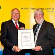 Amublanceman David Amer, 60, (right) being presented with a commendation by ambulance service chairman Richard Hunt