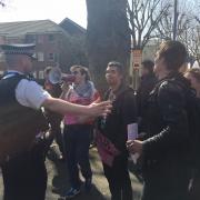 Protesters gather outside The Grove pub in Surbiton
