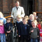 Fr Martin Hislop was presented with his new bicycle at the end of a Sunday service