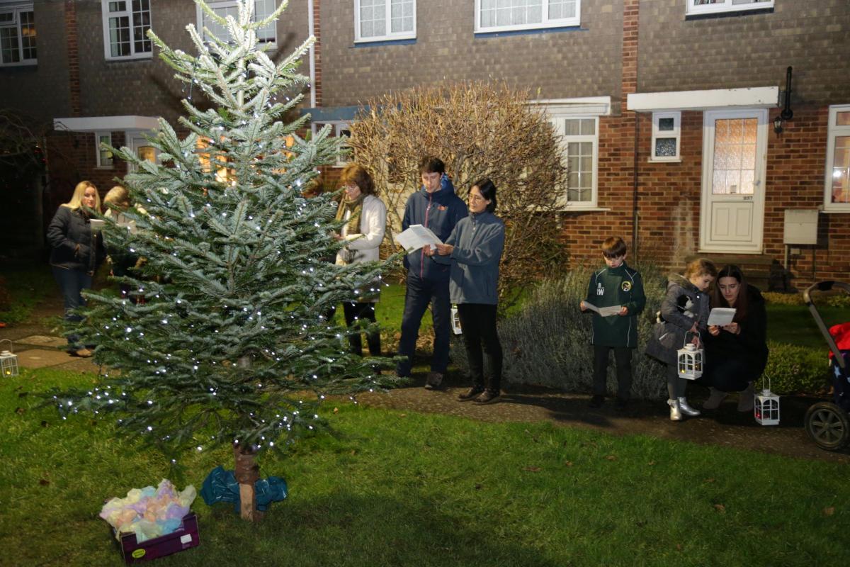 Fleetside residents in West Molesey gathered around a neighbourhood Christmas tree to sing carols before the 25th. The photo was sent in by Rod Thorn, from community group Friends of Fleetside.