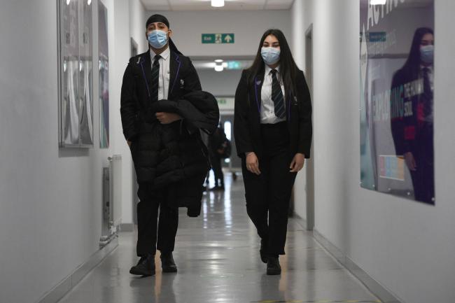 Face masks should be worn in communal areas in schools and colleges under new guidance (Kirsty O'Connor/PA)