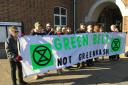 Campaigners at Spelthorne Borough Council offices hand over petition to save Green Belt land. Image: LDR