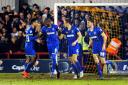 Part of the team: Ryan Sweeney, far right, enjoys the celebrations after Paul Robinson, second from right, bags the winning goal against Carlisle United