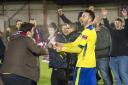 Good time in the gloom: Alan Inns celebrates lifting the Alan Turvey Trophy in an otherwise miserable last month of last season