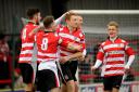 Opening things up: Defender Sam Page scored Kingstonian's first goal on Sunday
