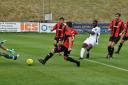 Ola Sogbanmu scores the winner for Carshalton Athletic at Lewes last Saturday. Picture: Ian Gerrard