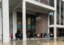 People queue for vaccine shots at Kingston University