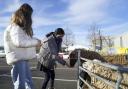 Veronika Brosnan, 12, (left) and Sama Ali, 14, stroke a sheep after being given a Covid vaccination at North East Surrey College of Technology (Nescot) in Epsom