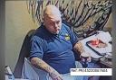 Surrey Police officers want to speak to this man who might help with an investigation into an assault at Epsom KFC