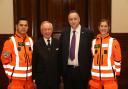 London Freemason Sir Michael Snyder, with Jonathan Jenkins, ceo of London Air Ambulance charity and medics