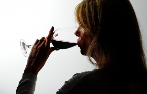 Surrey Comet: A woman drinking red wine. Credit: PA