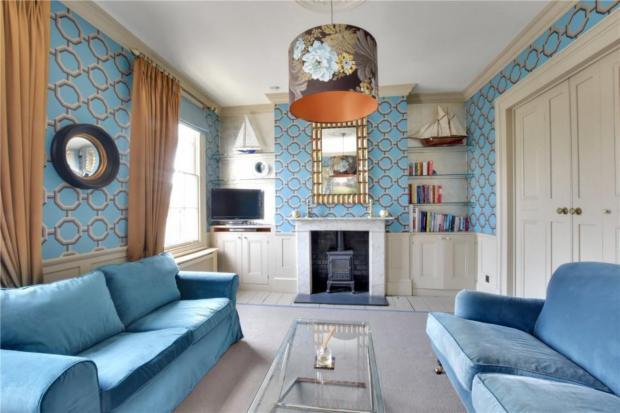 Surrey Comet: The living room features shades of blue. (Rightmove)