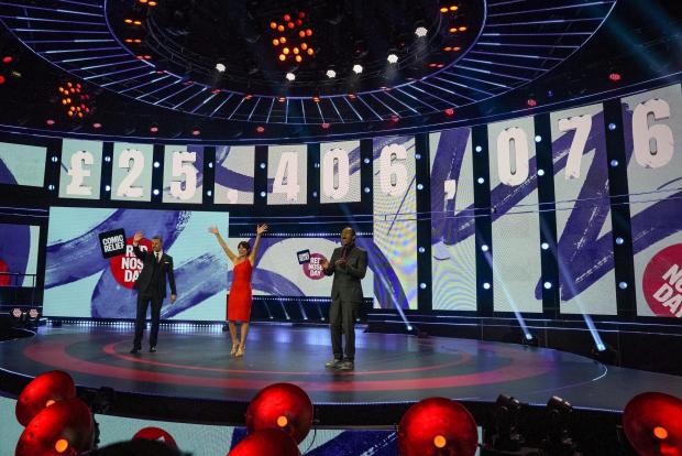 Surrey Comet: BBC handout photo of (left to right) Paddy McGuinness, Davina McCall and Lenny Henry presenting Comic Relief 2021. A total of £45,938,942 was raised during the 2021 event. 