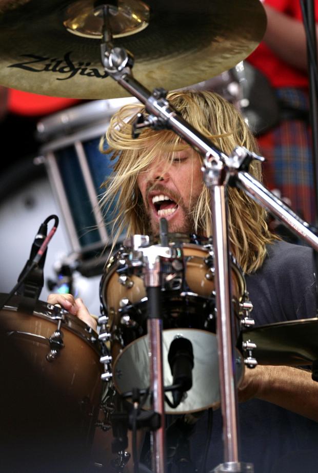 Surrey Comet: Taylor Hawkins performs during the Live Earth charity concert at Wembley Stadium, London (PA)