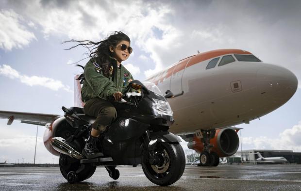 Surrey Comet: Rei Diec, aged 7 during filming of a parody of the movie Top Gun at Luton airport as part of easyJet's nextGen recruitment campaign. Credit: PA/easyJet