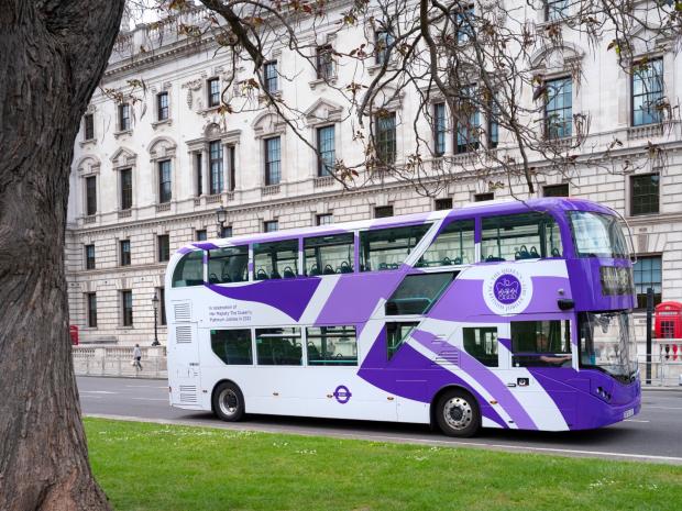 Surrey Comet:  The iconic red has vanished from London buses as they get a purple makeover. (PA)