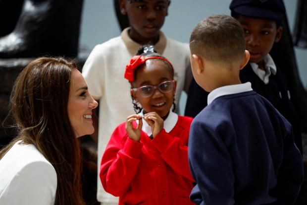 Surrey Comet: The Duchess of Cambridge speaks with children at the unveiling of the National Windrush Monument the unveiling of the National Windrush Monument at Waterloo Station, to mark Windrush Day