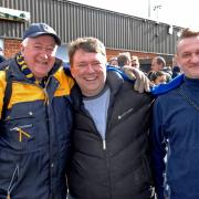 Founder member of AFC Wimbledon football club Kris Stewart (middle) at the ground during his election campaign