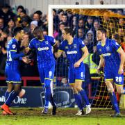 Part of the team: Ryan Sweeney, far right, enjoys the celebrations after Paul Robinson, second from right, bags the winning goal against Carlisle United