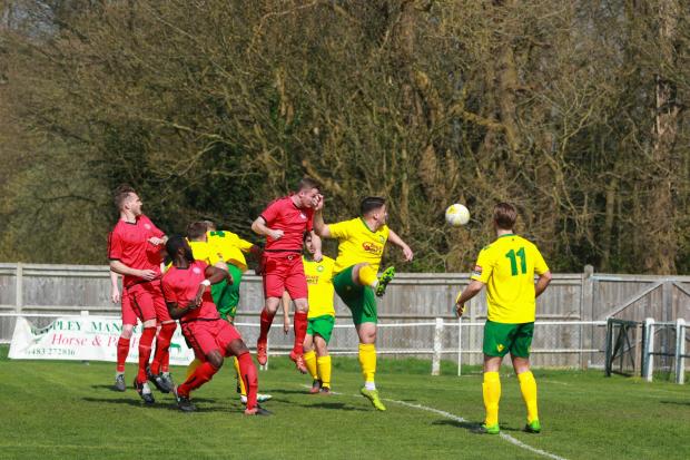 Daryl Cooper-Smith heads home to put Sutton Common Rovers ahead at Godalming Town